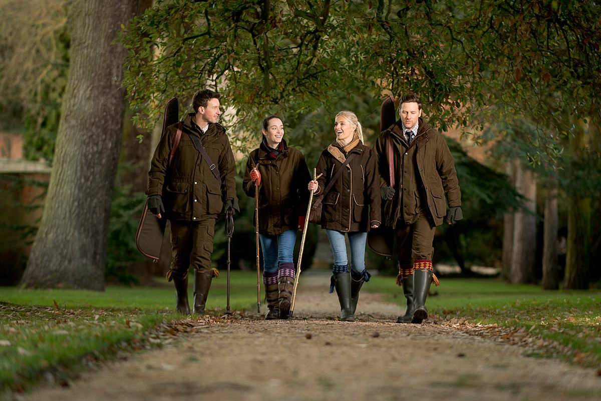 4 people walking in the countryside